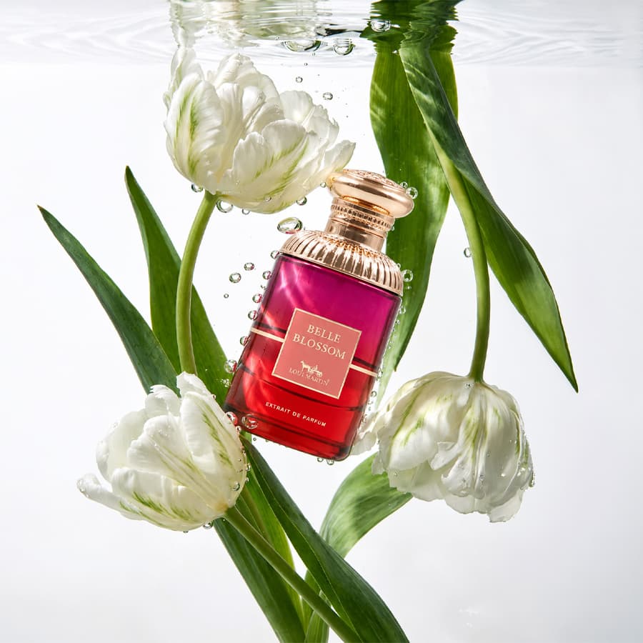Loui Martin Belle Blossom bottle underwater among white tulips
